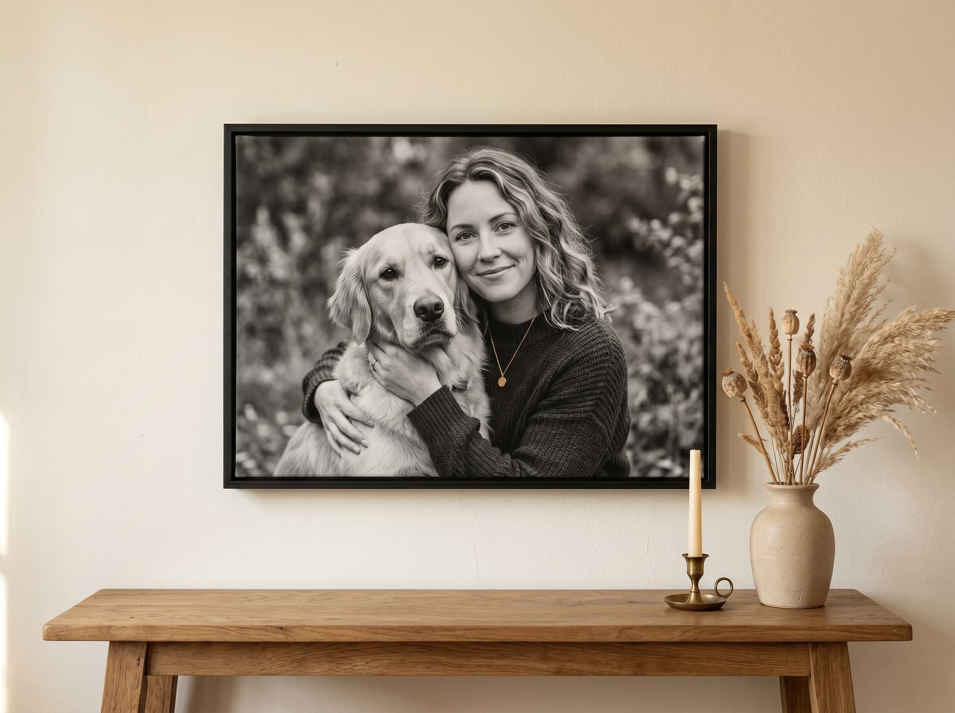 Framed canvas portrait hanging above a console table — editorial product mockup